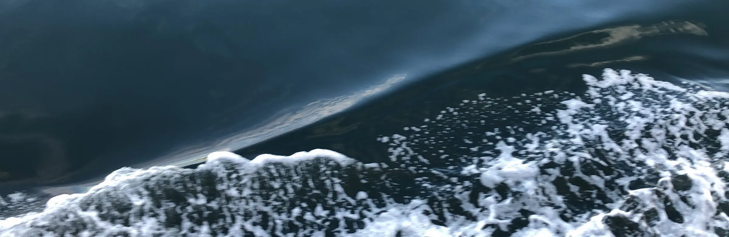 Dark water with white sea foam