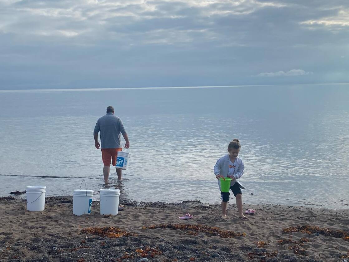 Buckets on a Nova Scotia shoreline during Tidal Salt's small-batch process